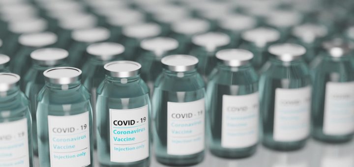 vials of blue liquid labelled as Covid-19 vaccine
